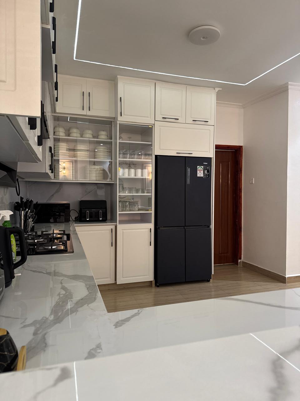 Luxurious living space with bespoke furnishings and warm natural light